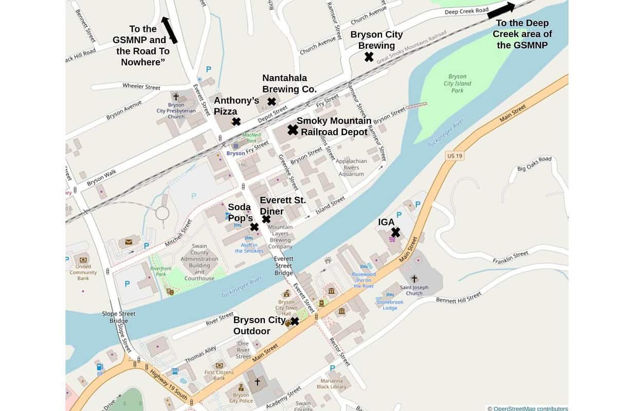 Map of Bryson City, highlighting locations like GSMNP and the Road to Nowhere, Nantahala Brewing Co., Smoky Mountain Railroad Depot, Anthony's Pizza, Everett St Diner, Soda Pops, Bryson City Outdoor—perfect for a biking adventure similar to the Swamp Rabbit Trail—and IGA along the Tuckasegee River.
