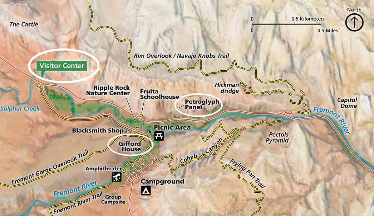 Map of Capitol Reef National Park showing landmarks such as the Visitor Center, Gifford House, Blacksmith Shop, Petroglyph Panel, campground, trails, Fremont River, and main roads with highlighted routes and labels.